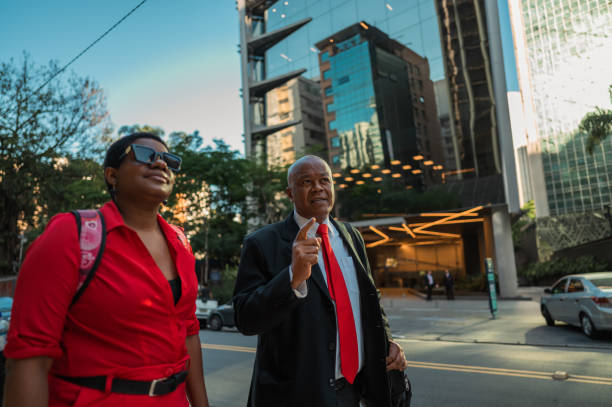 istock business man pointing and woman watching 1453868282