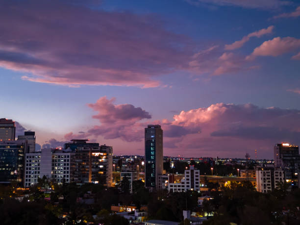 Aerial view of Mexico City south skyline along Periferico Sur, at sunset