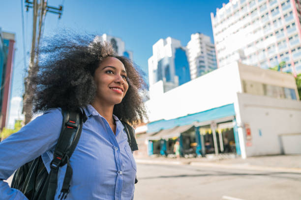 istock business woman watching and smiling 1453870011