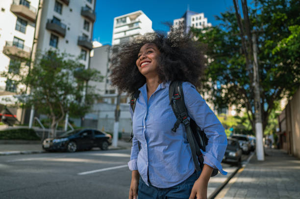 istock business woman watching and smiling 1453870015