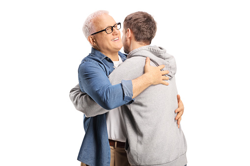 Happy father and son in embrace isolated on white background