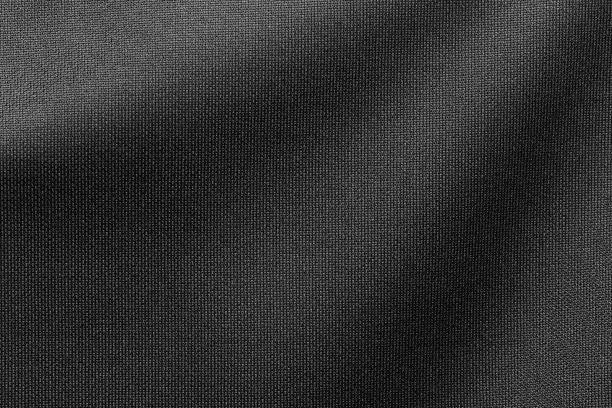 black color sports clothing fabric football shirt jersey texture and textile background. - moldura completa imagens e fotografias de stock