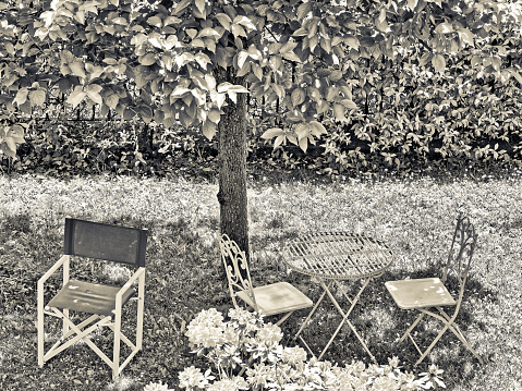 Outdoor armchairs in the garden of a rural hotel