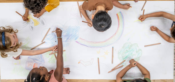 istock Children Coloring a Poster 1453878810