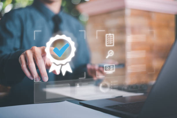 istock Businessman showing a validation icon, Concept of approval process, inspection and quality assurance, and a validation mark, a check mark symbol represents an international standard acceptance, 1453880085