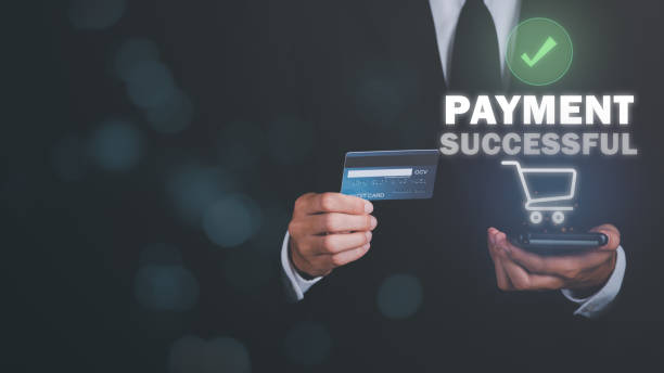 istock Young businessman using credit card to make financial transactions via smartphone, payment concept with wireless communication technology, focus on consumer safety and cashlessness,successful payment 1453880096