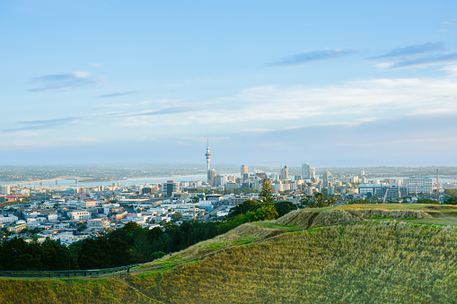 Auckland city skyline from top Mount Eden at sunrise.