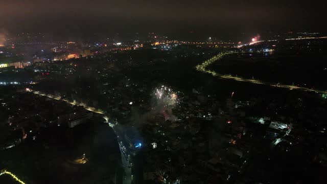 China, Yunnan, Honghe Prefecture, Yunnan, Jianshui Ancient City, Aerial photography of the night view of the ancient city at night, fireworks in the ancient city