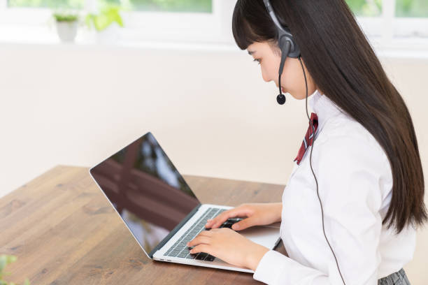 istock girl student ,laptop computer,correspondence course,School uniform, 1453884313