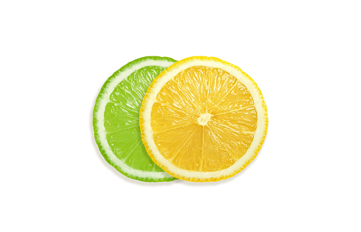 Juicy slices of lemon and lime isolated on white