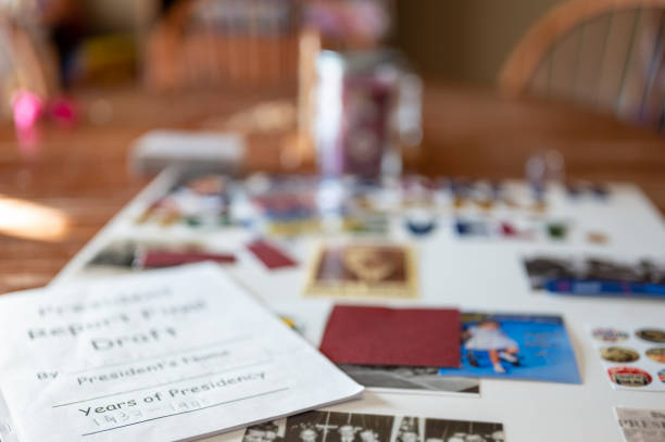 Defocused school book report poster board with pictures and text. Written report on top. Defocused school book report poster board with pictures and text. Written report on top. . High quality photo genealogy stock pictures, royalty-free photos & images