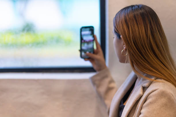 istock Woman taking a photo outside 1453890294