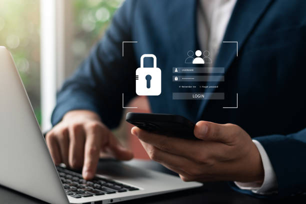 Cybersecurity and privacy concepts to protect data. Lock icon and internet network security technology. Businessmen protecting personal data on laptop and virtual interfaces. stock photo