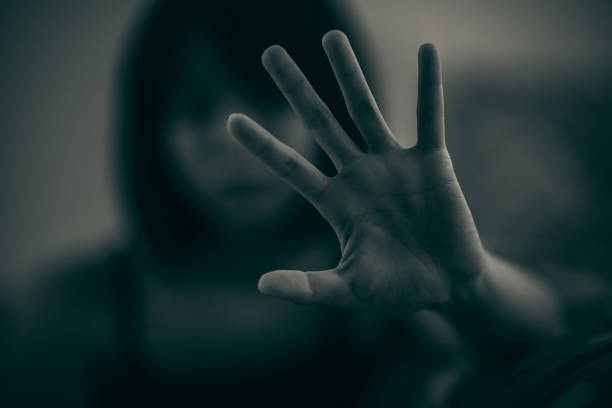 istock The woman held up her five-fingered hands, intent on telling her not to interfere. Concept of mental illness. 1453896029