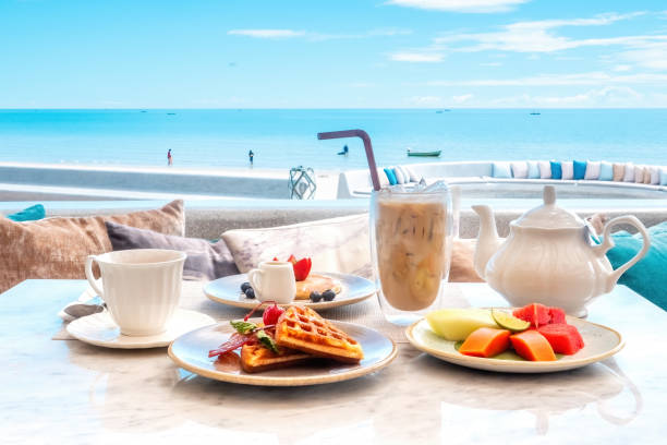 istock Sweet breakfast in cafe with belgian waffles, pancakes with berries 1453902757