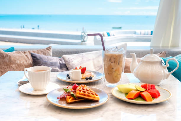 istock Sweet breakfast in cafe with belgian waffles, pancakes with berries 1453902783
