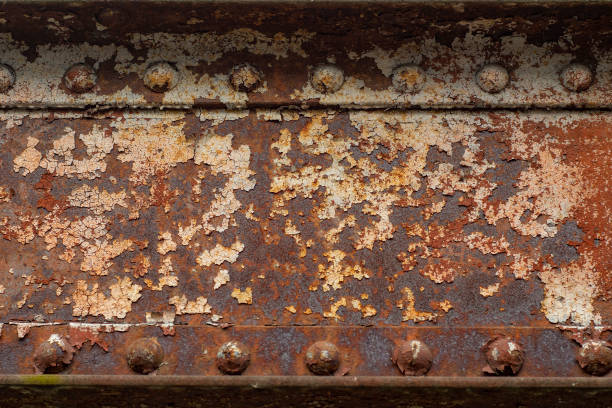istock Background with rusty metal beams and powerful rivets. Old bridge mounts. 1453906051