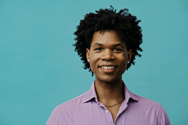 istock Confident young black man smiling looking at camera. Close up studio portrait. 1453908887