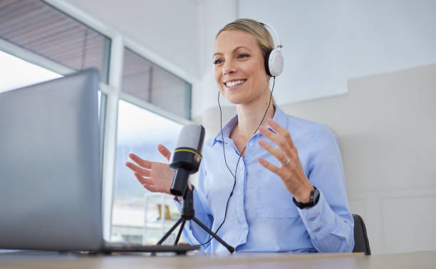 istock Podcast, radio interview or working digital web presenter live streaming talking to an audience. Internet voice talent, speaker or influencer with headphones and microphone talk online about business 1453912146
