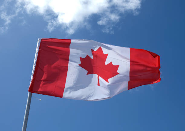 canada flag waving - canada american flag canadian culture usa imagens e fotografias de stock