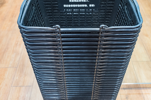 Stack of supermarket shopping baskets