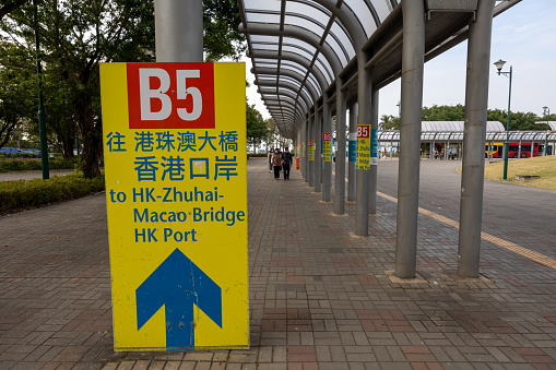 Hong Kong - January 2, 2023 : Bus to Hong Kong-Zhuhai-Macao Bridge Hong Kong Port at Sunny Bay Public Transit Interchange in Lantau Island, Hong Kong.