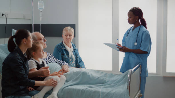 istock African american assistant explaining medication to old man and visitors 1453918487