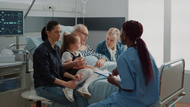 Medical assistant talking about diagnosis with woman in visit