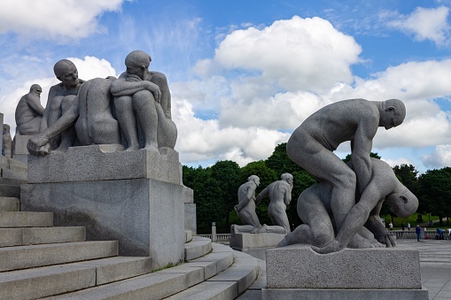 Oslo, Norway – June 06, 2013: The modern sculptures, human figures in the Vigeland park in Oslo, Norway, the concept of spirituality