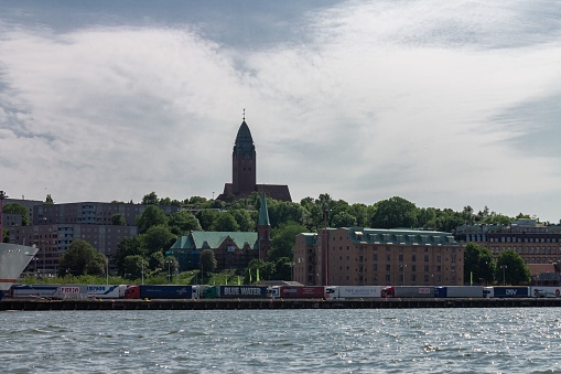 Gothenburg, Sweden – June 07, 2013: A beautiful shot of historical buildlings at the shore of the Gota alv river in Gothenburg, Sweden