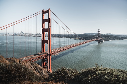 The view of the Golden Gate Bridge from the northern viewpoint with San Francisco skyline in the background