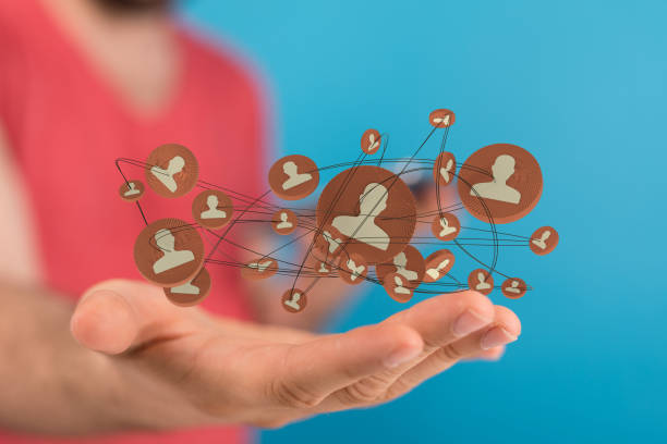 istock 3D rendering of people icons hovering over a man's hand 1453925953