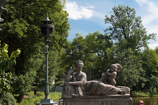 Warsaw, Poland – June 14, 2013: A closeup shot of classical baroque sculpture inside Lazienki Park, Warsaw, Poland