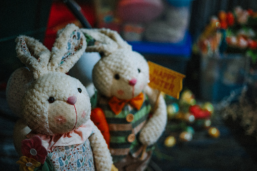 A closeup of knitted bunny toys of an Easter celebration