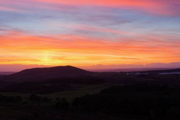 istock Intense sunset silhouetting Corndon Hill, Wales 1453929074