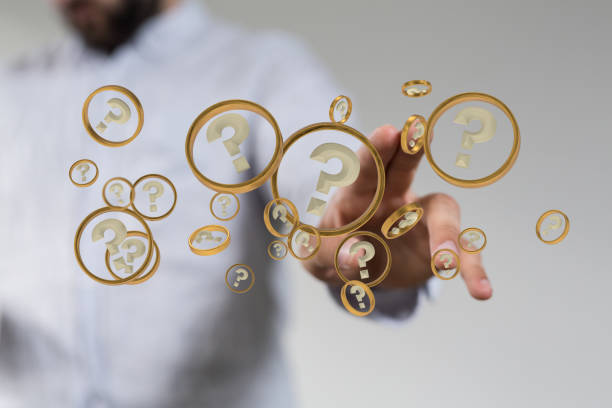 istock Person presenting the virtual projection of question marks 1453929397