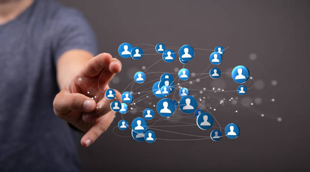 istock Person presenting the virtual projection of human network 1453929643