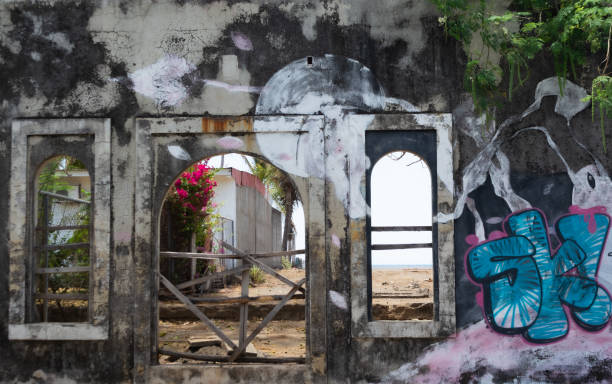 Poneloya, Nicaragua – March 28, 2022: An abandoned building wall with graffiti on a beach in Poneloya, Nicaragua