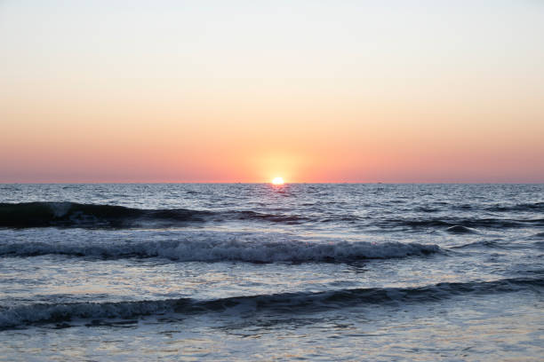 istock Beautiful sunset on the beach Colva Beach - South Goa, India 1453931685