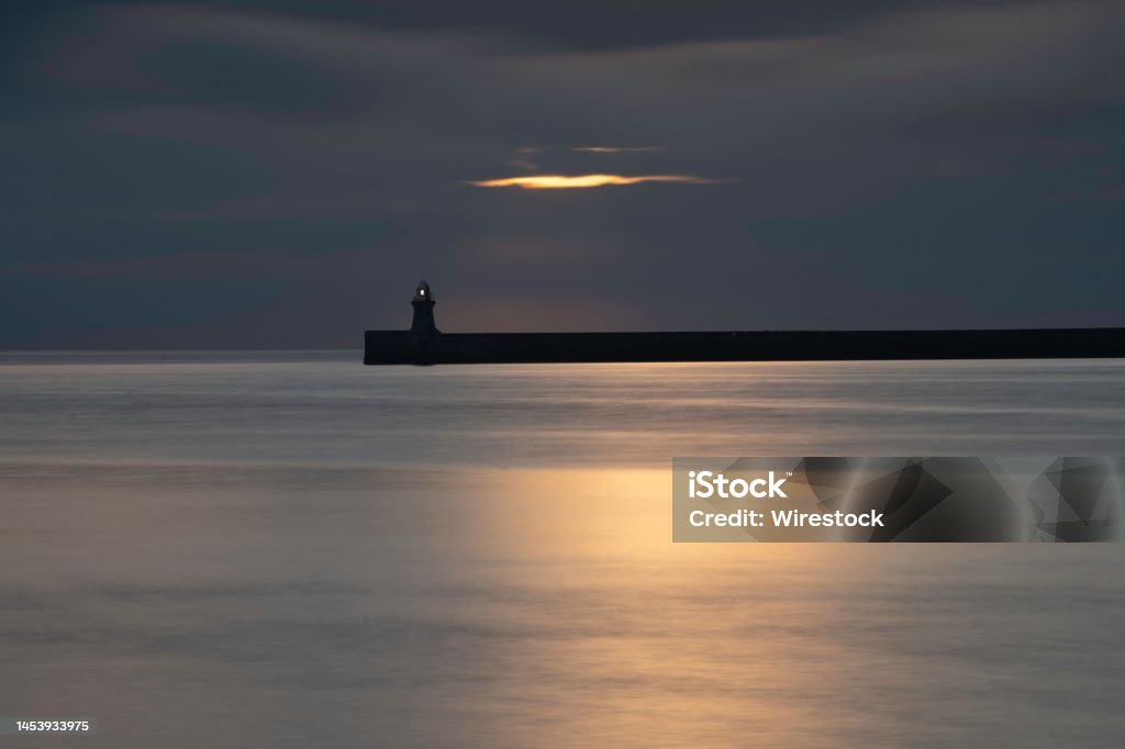 Tranquil view of the South Shields pier and lighthouse at sunrise in Tynemouth, England A tranquil view of the South Shields pier and lighthouse at sunrise in Tynemouth, England Building Exterior Stock Photo