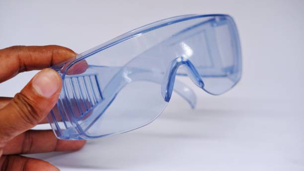 istock Blue protective spectacles on white background isolated, close up full face. Goggles or Safety Glasses. Protective workwear to protect human eyes. 1453934822