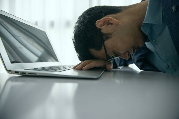 istock Tired businessman 1453943060