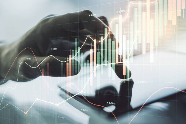 istock Abstract creative financial graph with finger clicks on a digital tablet on background, forex and investment concept. Multiexposure 1453943787