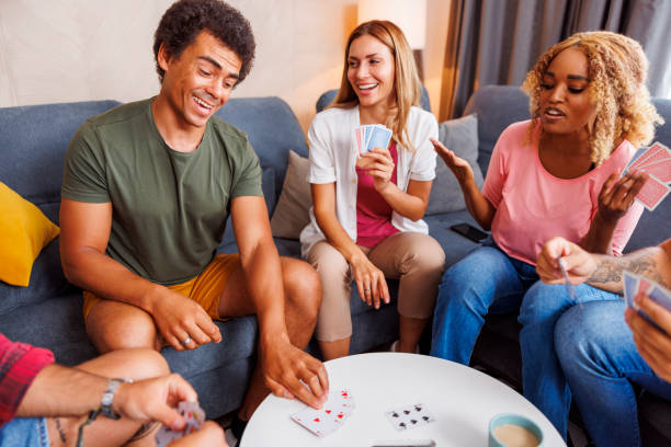 istock Friends playing card games 1453944480
