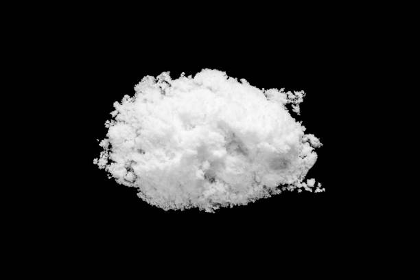 istock White snow isolated on black background close up 1453945365