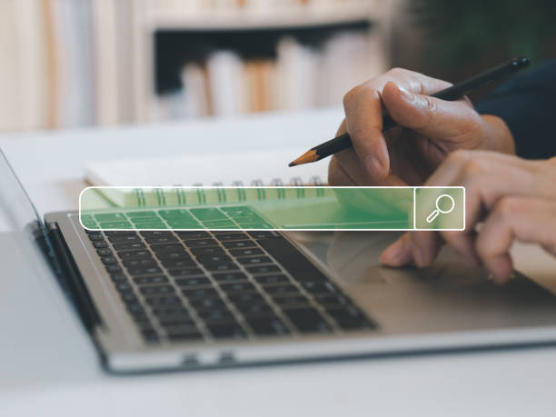 istock Man typing in laptops to finding information or shopping online. 1453947158