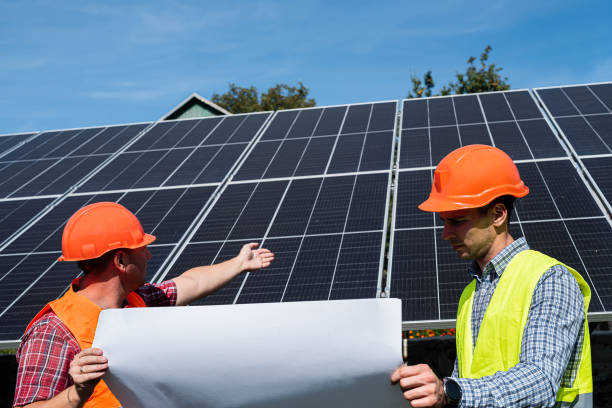 istock Two engineers discussion plan to find problem solar photovoltaic panels 1453948085