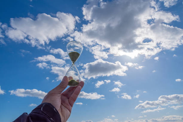 istock person with hourglass 1453948107