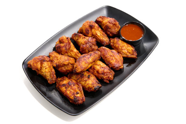 istock plate with barbecue chicken wings 1453951704