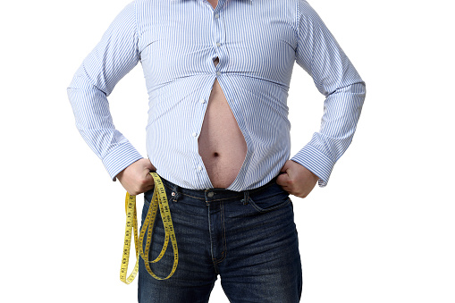 Isolated shot of obese man wearing tight shirt